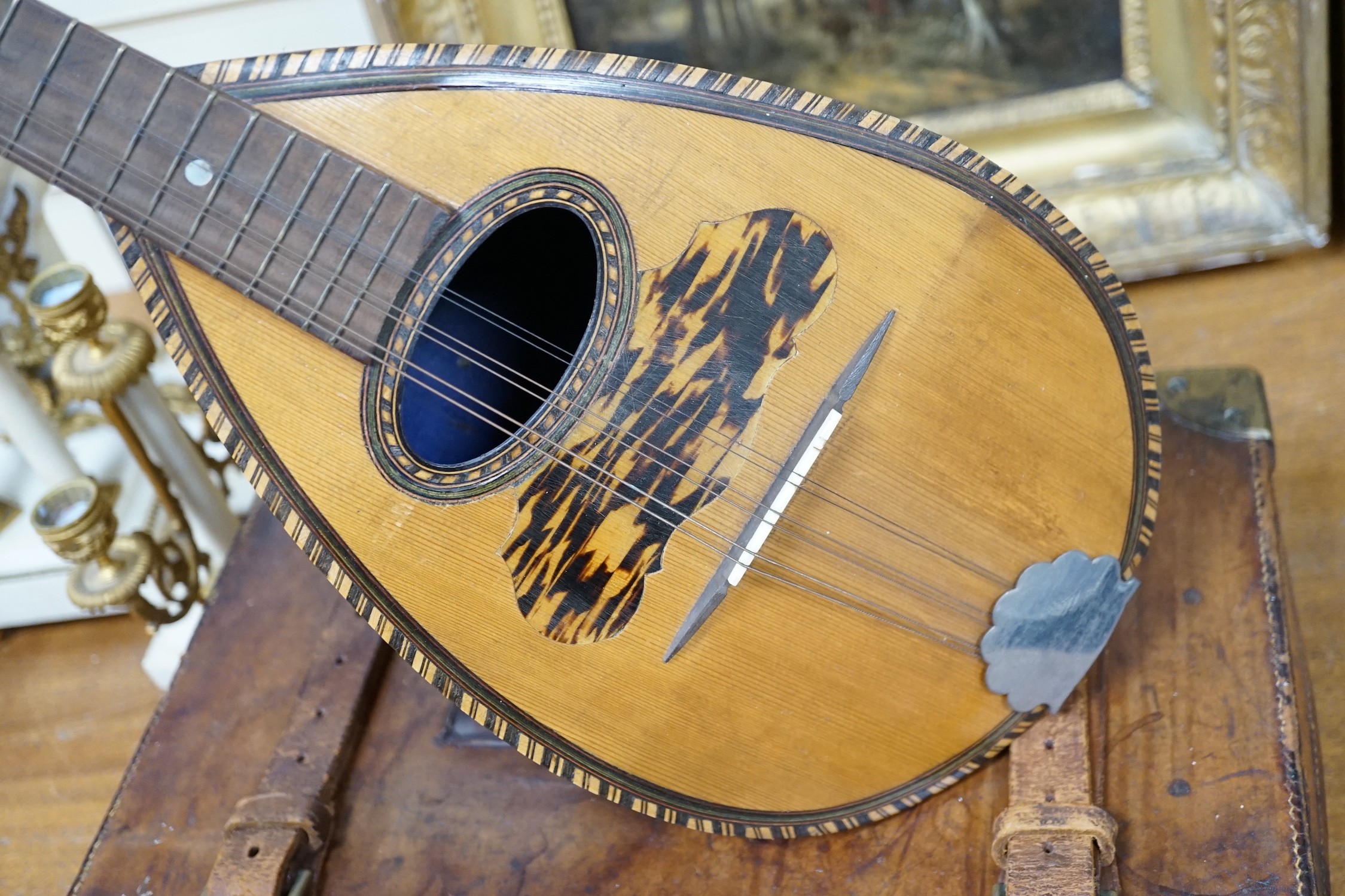 A late 19th century German violin together with an Italian mandolin, (both cased)